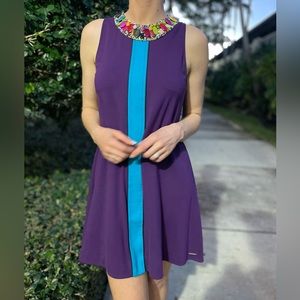 Bella Bicchi Purple Swing Dress with Teal Stripe, Embellished Neckline, and Bow